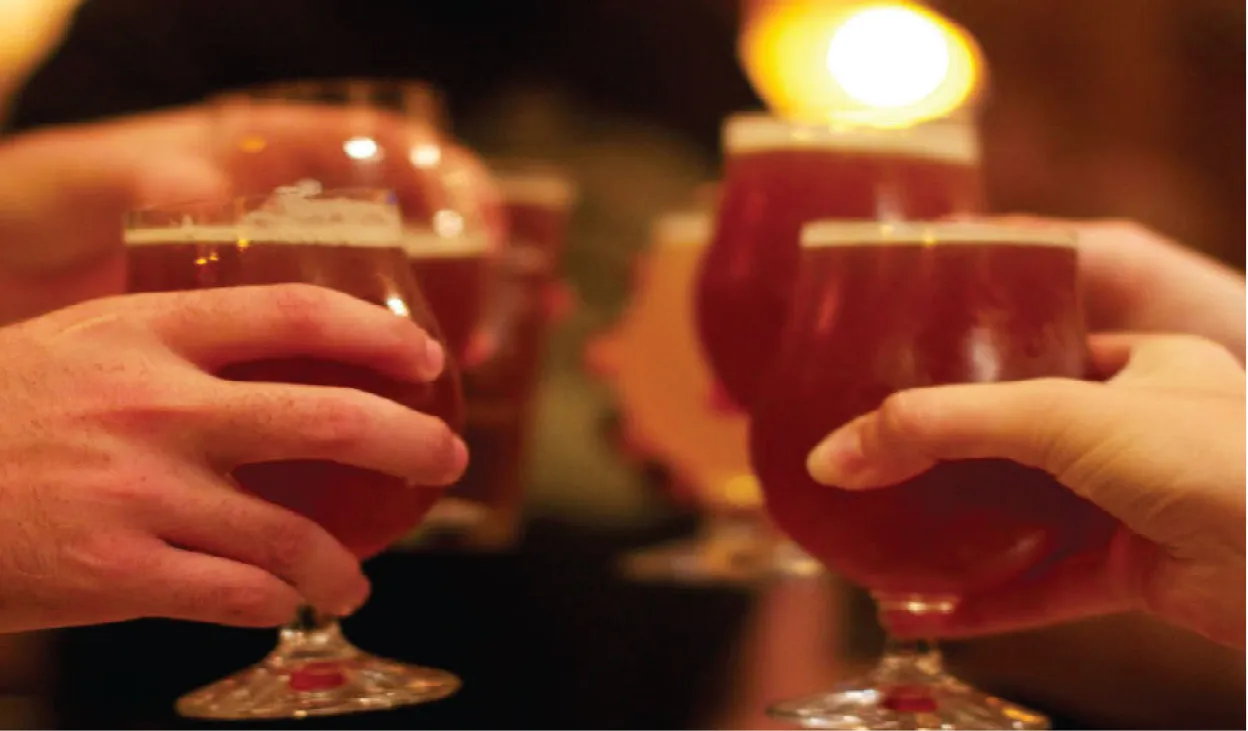 People toasting craft beer.